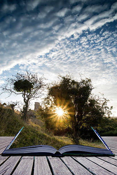 istock Castle ruins landscape at sunrise with inspirational sunburst be 522132039