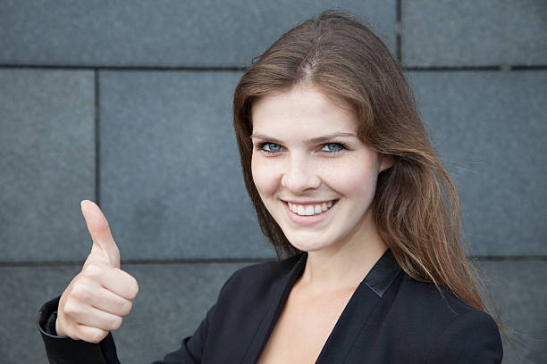 istock Attractive young woman showing thumbs up 522132335