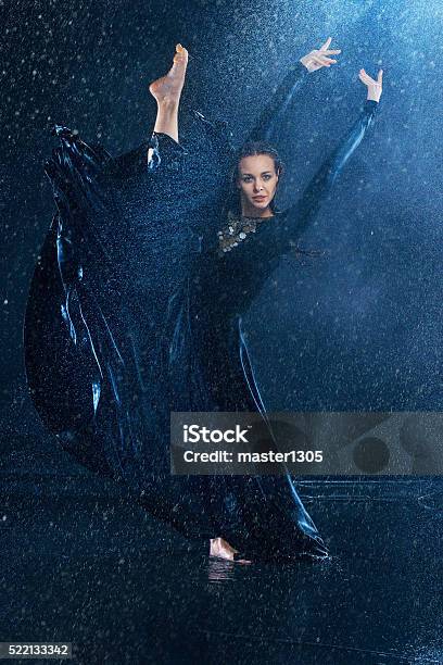 The Young Beautiful Modern Dancer Dancing Under Water Drops Stock Photo - Download Image Now