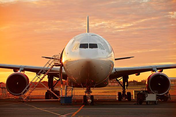 istock Airplane at the sunrise 522133401