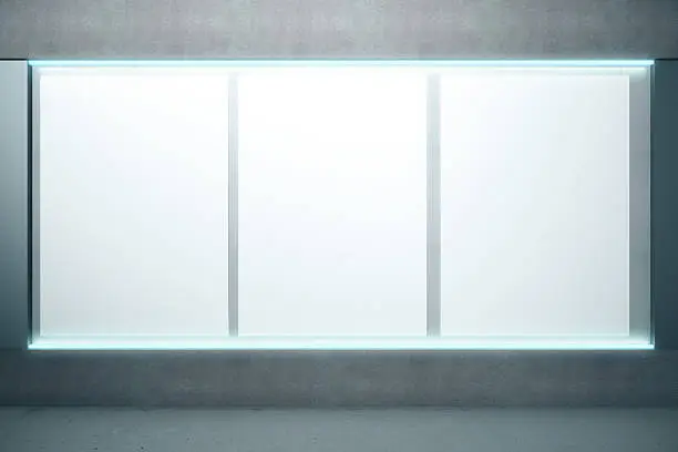 Photo of Blank glowing posters on the wall, mock up