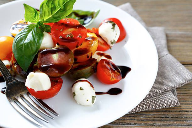 istock fresh Caprese salad on a white plate 522134937