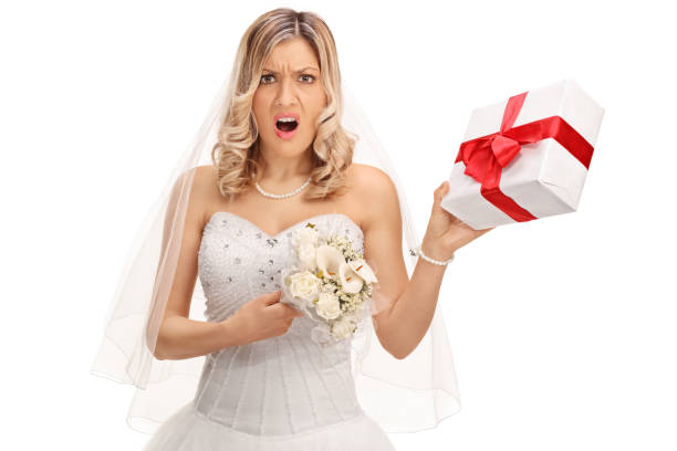 istock Displeased bride holding a wedding present 522135490