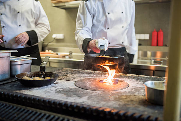 istock Chef preparing meal on the oven 522136362