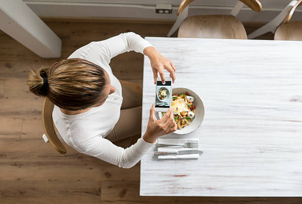 istock Woman using food app on her cell phone 522138226