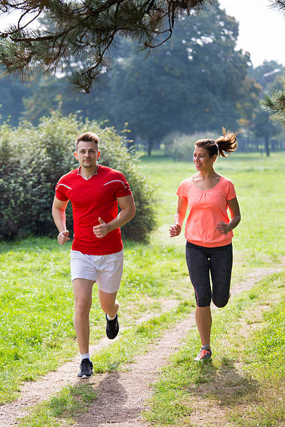 istock Young people running in the park 522138468