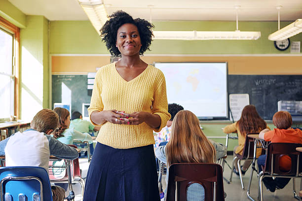 I engage minds Portrait of a young teacher with her learners in the background instructor stock pictures, royalty-free photos & images