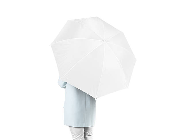 istock Women stand backwards with white blank umbrella mock up isolated 522139092