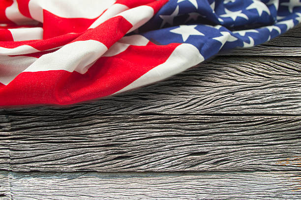 istock American flag on wooden background 522139758
