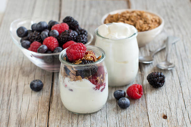 Breakfast with Fresh greek yogurt, muesli and berries Healthy breakfast with Fresh greek yogurt, muesli and berries greek yogurt photos stock pictures, royalty-free photos & images