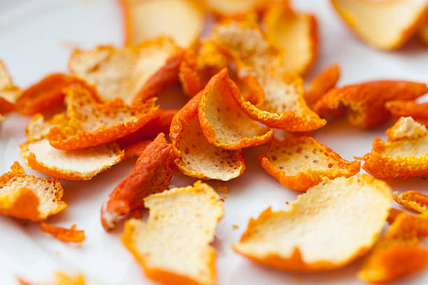 dried orange zests dried orange zests on white background peel plant part stock pictures, royalty-free photos & images