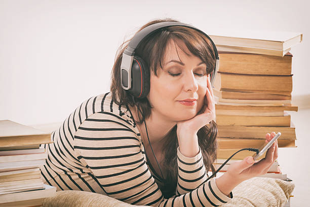 istock Woman listening an audiobook 522142548