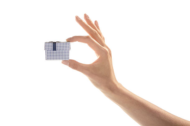 istock Woman hand holding blue gift box 522144110
