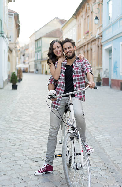 istock man on a bike with his girlfriend behind 522144776