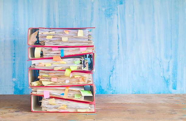 stack of messy file folders stack of messy file folders and documents,free copy space handbook stock pictures, royalty-free photos & images