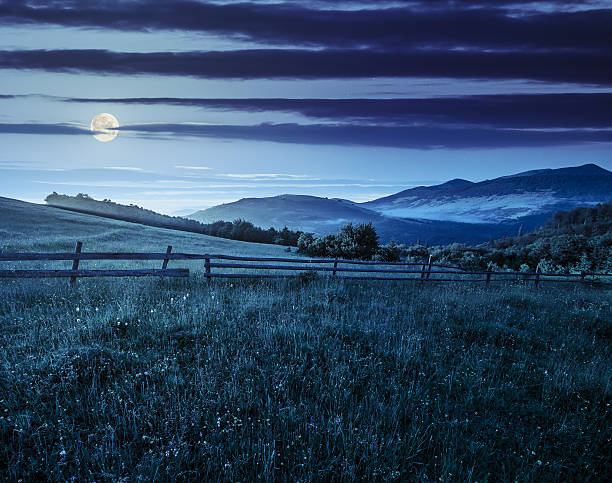 istock fence on hillside meadow in mountain at sunrise 522145092