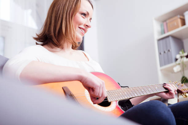 istock Beautiful brown haired girl sitting smiling on sofa 522146200