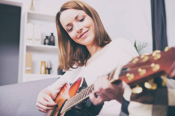 istock Attractive brown haired girl sitting smiling on couch 522146214