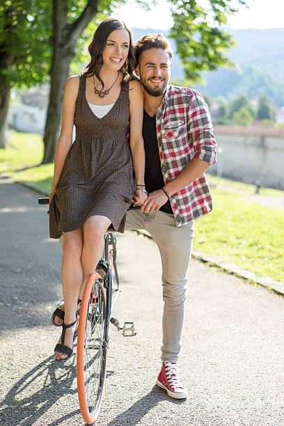 istock couple smiling on bike 522147962