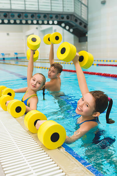 istock Happy and smiling group of children doing exercises in a 522148906