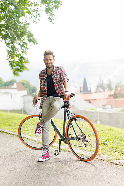istock Handsome man with a city bike 522149234