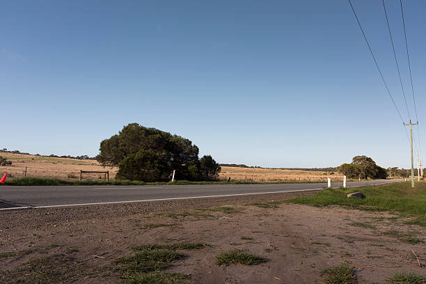 istock Empty Highway in a Rural Area with a Field Behind 522151458