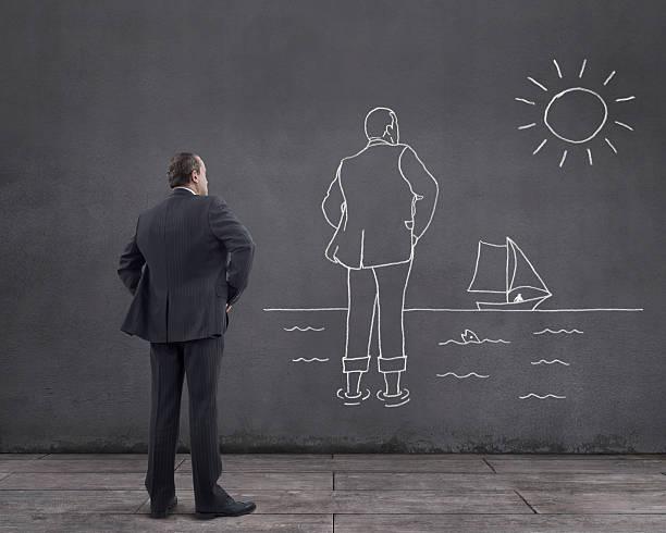 istock Businessman with Longing for Summer Holiday Sketched on the Wall 522151808