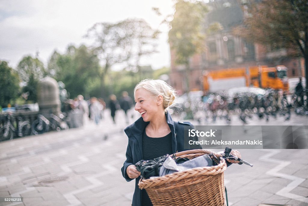 Finishing my chores Young woman enjoying bicycle riding, while finishing her chores in the city Copenhagen Stock Photo