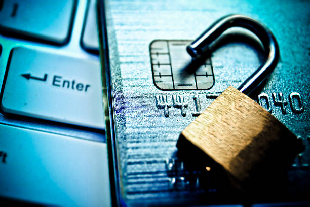 credit card data security Open security lock on credit cards with computer keyboard / Credit card data breach identity theft photos stock pictures, royalty-free photos & images