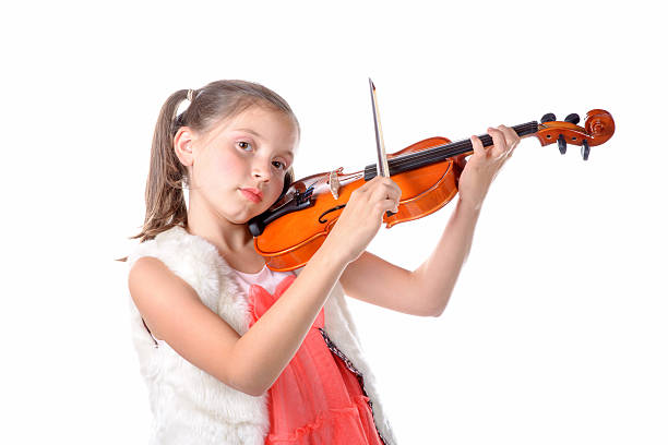 istock pretty little girl playing the violin 522154743