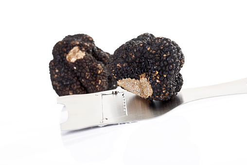 Black truffle with truffle slicer