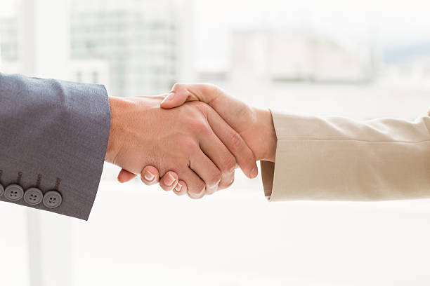 istock Close-up of business people shaking hands 522156257