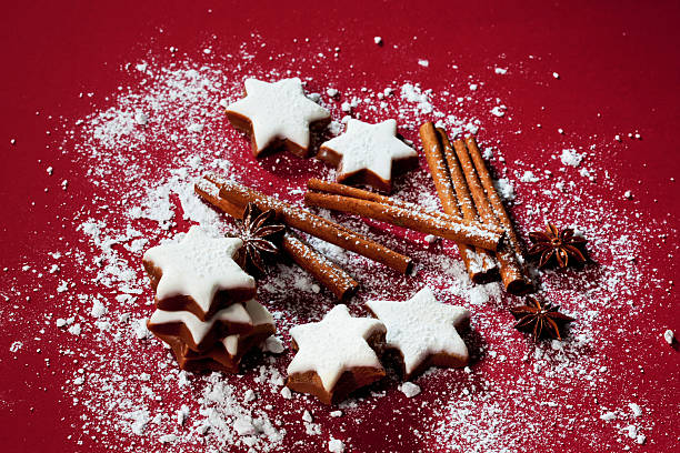 Cinnamon stars and spices sprinkled with powder sugar