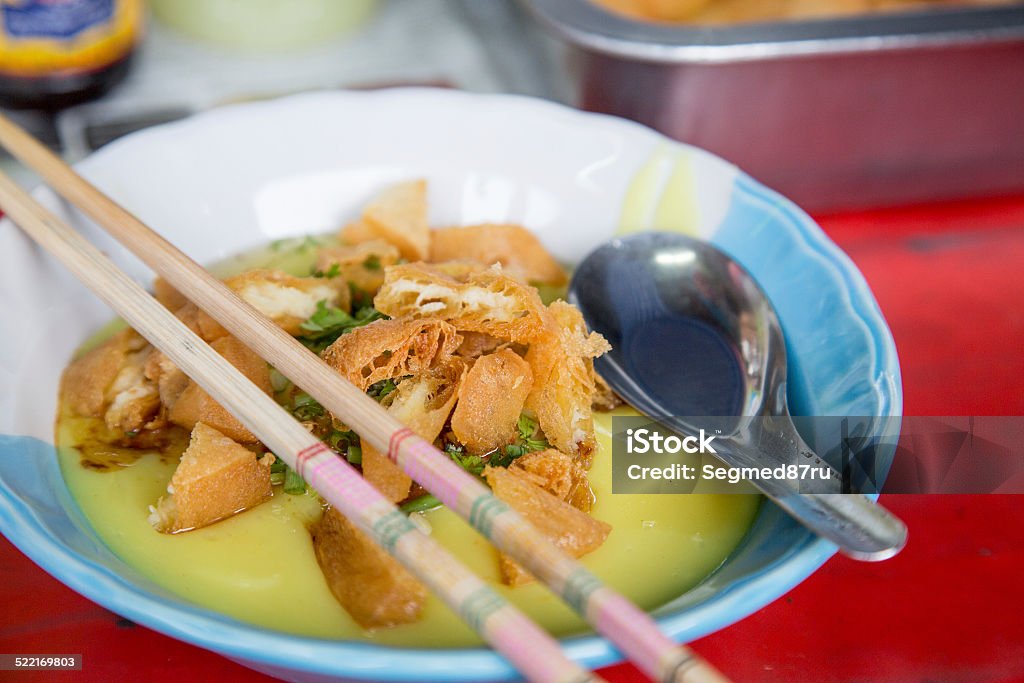 Tofu porrige Tofu porrige with donuts - traditional food of tribal north thai peolpe. Boiled Stock Photo