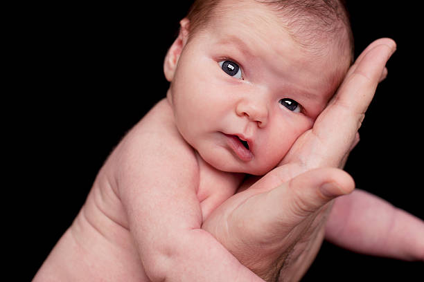 istock Newborn in fathers hand 522170263