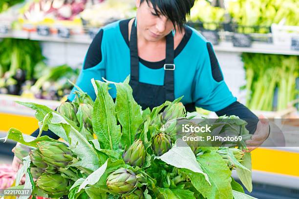 Young Woman With Bunch Of Artichokes Stock Photo - Download Image Now - 30-39 Years, Adult, Adults Only