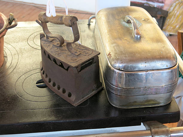 istock heavy antique flat iron above the old kitchen stove 522171445