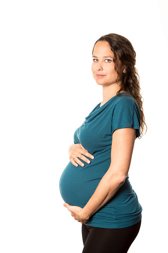 Pregnant woman with hands over tummy