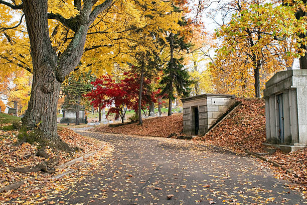 istock Cemetery Road Past Mausoleums in Fall 522182853