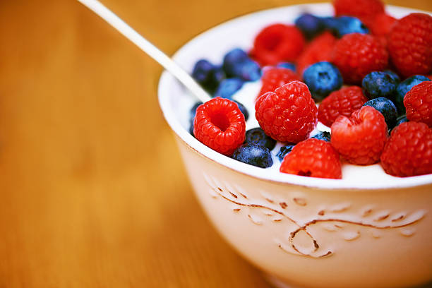 Closeup shot of a delicious bowl of berries in yoghurt