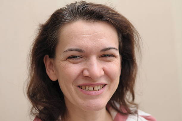 Portrait of woman in her 40 s smiling happy