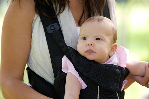 istock Mother with infant baby in sling 522183509