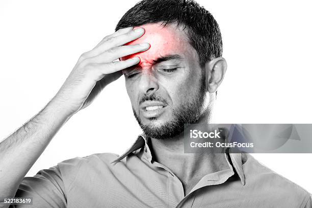 Young Man Suffering Headache And Migraine In Pain Expression Stock Photo - Download Image Now