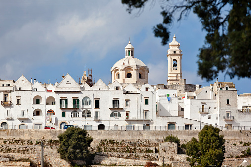 One of the famous Citta Blanca, White Towns, the hilltop town of Locorotondo in Puglia, southern Italy which is officially listed as one of the most beautiful in Italy, with particular reference to the historic old town. The town is known principally for its white wine production.