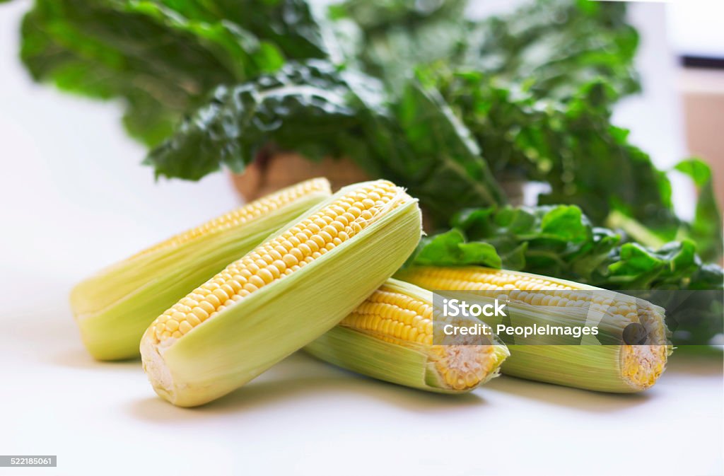 Make everyday a healthy day Closeup still life of shucked corn and spinich Cereal Plant Stock Photo