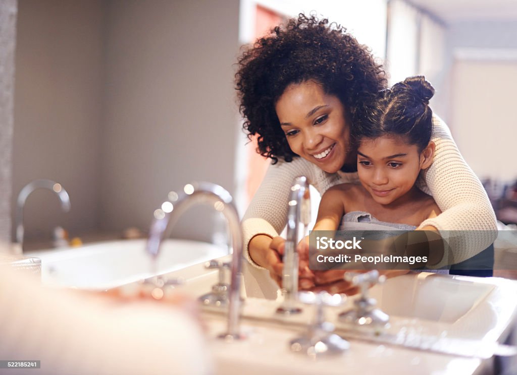 Teaching her about good hygiene Cropped shot of a mother and daughter washing their hands at the bathroom sinkhttp://195.154.178.81/DATA/shoots/ic_784169.jpg Washing Hands Stock Photo