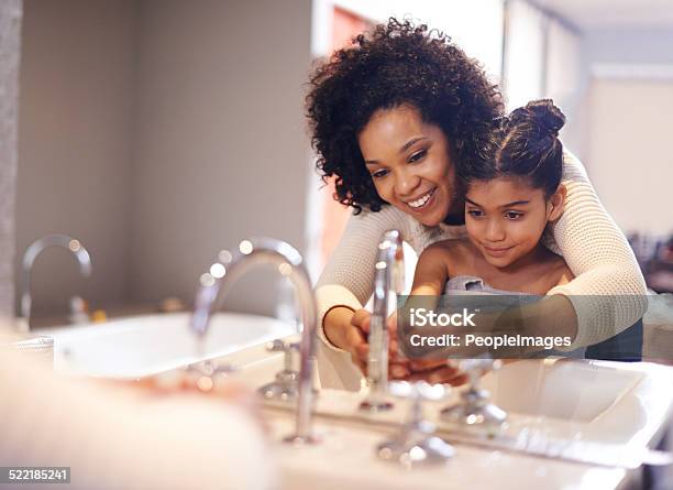 Teaching Her About Good Hygiene Stock Photo - Download Image Now - Washing Hands, Child, Bathroom