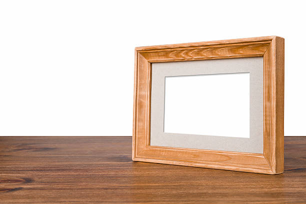 istock Blank wooden picture frame on table over white background 522186523