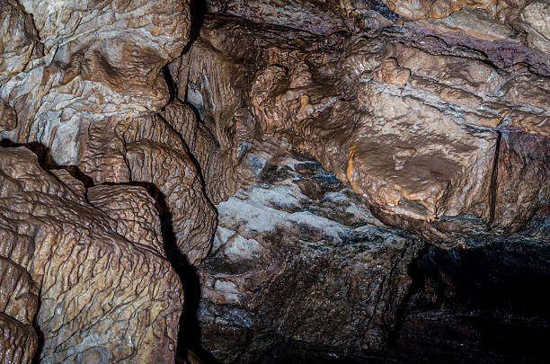 istock spelunking,caving,pot holing,speleology,exploration. colour image, 522187521