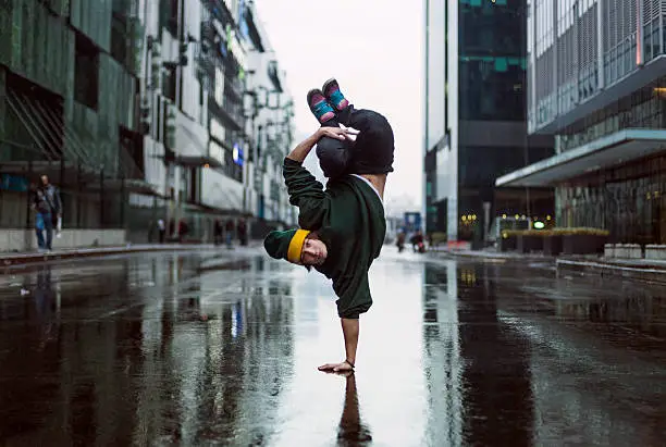 Handstand dancer in the street in Moscow, teenage dancer. Breakdancer. Hip Hop.